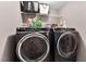 Modern laundry room with front load washer and dryer at 1952 Grassy Banks Dr, Raleigh, NC 27610