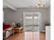 Living room featuring a sliding glass door to backyard and a leather sofa at 1952 Grassy Banks Dr, Raleigh, NC 27610