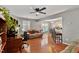 Inviting living room with hardwood floors, ceiling fan, and an open layout at 1952 Grassy Banks Dr, Raleigh, NC 27610