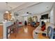 Comfortable living room with hardwood floors, ceiling fan and bar seating at kitchen counter at 1952 Grassy Banks Dr, Raleigh, NC 27610