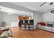 Open-concept living room featuring hardwood floors and a bar-style seating area at 1952 Grassy Banks Dr, Raleigh, NC 27610
