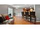 Comfortable living room featuring hardwood floors and bar seating at 1952 Grassy Banks Dr, Raleigh, NC 27610