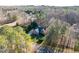 Expansive aerial view of a home nestled amongst mature trees on a sprawling lot at 2030 Lonesome Dove Dr, Franklinton, NC 27525