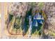 Aerial view of a home with a long driveway surrounded by trees on a large lot at 2030 Lonesome Dove Dr, Franklinton, NC 27525