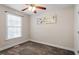 Bedroom with neutral walls, carpet flooring, and a window for natural light at 2030 Lonesome Dove Dr, Franklinton, NC 27525