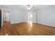 Primary bedroom with hardwood flooring, ceiling fan, and en-suite bathroom at 2030 Lonesome Dove Dr, Franklinton, NC 27525