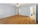 Large primary bedroom with hardwood floors, a ceiling fan, and access to a private bath at 2030 Lonesome Dove Dr, Franklinton, NC 27525