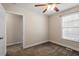Cozy bedroom with carpet flooring, a ceiling fan, and a nearby closet at 2030 Lonesome Dove Dr, Franklinton, NC 27525