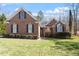 Charming brick home with manicured lawn, black shutters, and inviting entrance at 2030 Lonesome Dove Dr, Franklinton, NC 27525