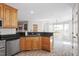 Bright kitchen with wooden cabinetry, dark granite countertops, and stainless steel appliances at 2030 Lonesome Dove Dr, Franklinton, NC 27525