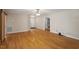 Open living area with hardwood floors, neutral walls, and modern sliding door at 2030 Lonesome Dove Dr, Franklinton, NC 27525