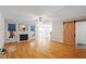 Inviting living room with hardwood floors, fireplace, and stylish barn door at 2030 Lonesome Dove Dr, Franklinton, NC 27525