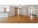Open concept living space with hardwood floors, barn door, and seamless flow to kitchen at 2030 Lonesome Dove Dr, Franklinton, NC 27525