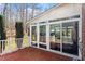 Outdoor patio with nice deck, white railing, sliding glass door and lots of natural light at 2030 Lonesome Dove Dr, Franklinton, NC 27525