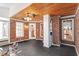 Unique sunroom with brick walls, wood ceiling, and a ceiling fan provides a comfortable space at 2030 Lonesome Dove Dr, Franklinton, NC 27525