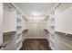 Walk-in closet with built-in shelving and hanging rods at 2030 Lonesome Dove Dr, Franklinton, NC 27525
