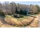Large yard with mature trees surrounding a traditional home at 2030 Lonesome Dove Dr, Franklinton, NC 27525