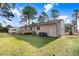 Enjoy a spacious backyard and a cozy deck, ideal for outdoor gatherings and relaxation at 210 S General Lee Ave, Dunn, NC 28334