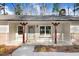 Inviting front porch with decorative window boxes and stylish wood columns offers a charming welcome at 210 S General Lee Ave, Dunn, NC 28334
