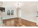 Bright living room boasts hardwood floors, a stone fireplace, and natural light at 210 S General Lee Ave, Dunn, NC 28334