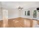 This inviting living area boasts hardwood floors, a cozy fireplace, and ample space for relaxation at 210 S General Lee Ave, Dunn, NC 28334
