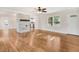 The living room boasts gleaming hardwood floors, a stone fireplace, and an open layout for entertaining at 210 S General Lee Ave, Dunn, NC 28334