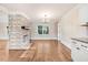 Charming living room showcasing hardwood floors and a stone fireplace feature at 210 S General Lee Ave, Dunn, NC 28334