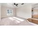Spacious main bedroom featuring neutral paint, carpet, and a bright window at 210 S General Lee Ave, Dunn, NC 28334