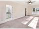 Relaxing main bedroom with a ceiling fan, plush carpeting, and ensuite bathroom at 210 S General Lee Ave, Dunn, NC 28334