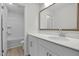 Bathroom features a well-lit vanity with a sink and a view into the bath and shower at 2156 Pink Peony Cir # 157, Durham, NC 27703