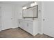 Bright bathroom featuring a double sink vanity, framed mirror, and modern fixtures at 2156 Pink Peony Cir # 157, Durham, NC 27703