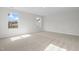 Serene bedroom with plush carpeting and views of the outside, creating a peaceful atmosphere at 2156 Pink Peony Cir # 157, Durham, NC 27703