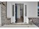 Welcoming entryway with a blue door and sidelights, offering a glimpse into the home's interior at 2156 Pink Peony Cir # 157, Durham, NC 27703