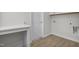 Well-organized laundry area offers convenience with storage space and modern utility connections at 2156 Pink Peony Cir # 157, Durham, NC 27703