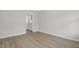 Open-concept living room showcases hardwood floors, neutral paint, and ample natural light at 2156 Pink Peony Cir # 157, Durham, NC 27703