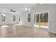 Open-concept living area with large windows and sliding glass doors to the outdoor space at 2156 Pink Peony Cir # 157, Durham, NC 27703