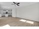 Open-concept living area connects to the kitchen, featuring sleek floors and bright lighting at 2156 Pink Peony Cir # 157, Durham, NC 27703