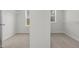 Spacious walk-in closet with carpet and abundant natural light at 2156 Pink Peony Cir # 157, Durham, NC 27703