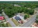 Aerial view of home, showing its location amongst the trees and surrounding neighborhood at 221 Charlotte Ave, Sanford, NC 27330