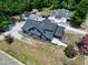 An aerial view showcasing the home, its well-maintained yard, and the surrounding neighborhood at 221 Charlotte Ave, Sanford, NC 27330