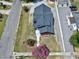 Aerial view of charming home featuring a well-maintained yard and a modern roof at 221 Charlotte Ave, Sanford, NC 27330