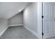 Finished attic space, carpeted and painted neutral, ready to be used as bonus room or storage at 221 Charlotte Ave, Sanford, NC 27330