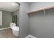 Bright bathroom featuring a stand alone tub, double sink, and views to a closet and window at 221 Charlotte Ave, Sanford, NC 27330