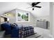 Nicely decorated bedroom, with a large window providing natural light and featuring a ceiling fan at 221 Charlotte Ave, Sanford, NC 27330