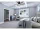 Comfortable bedroom with coffered ceilings, sitting area, walk-in closet, and large window at 221 Charlotte Ave, Sanford, NC 27330