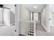 Upstairs hallway with carpet flooring and white wood trim and doors at 221 Charlotte Ave, Sanford, NC 27330