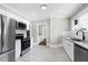 Kitchen with stainless steel appliances, white cabinets, and subway tile backsplash at 221 Charlotte Ave, Sanford, NC 27330