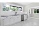 Kitchen with white cabinets, stainless steel appliances, granite countertops and subway tile backsplash at 221 Charlotte Ave, Sanford, NC 27330