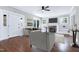 Bright living room featuring hardwood floors, a fireplace, built-in shelving, and comfortable seating at 221 Charlotte Ave, Sanford, NC 27330
