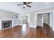 Spacious living room with hardwood floors, fireplace, built-in shelves, and plenty of natural light at 221 Charlotte Ave, Sanford, NC 27330